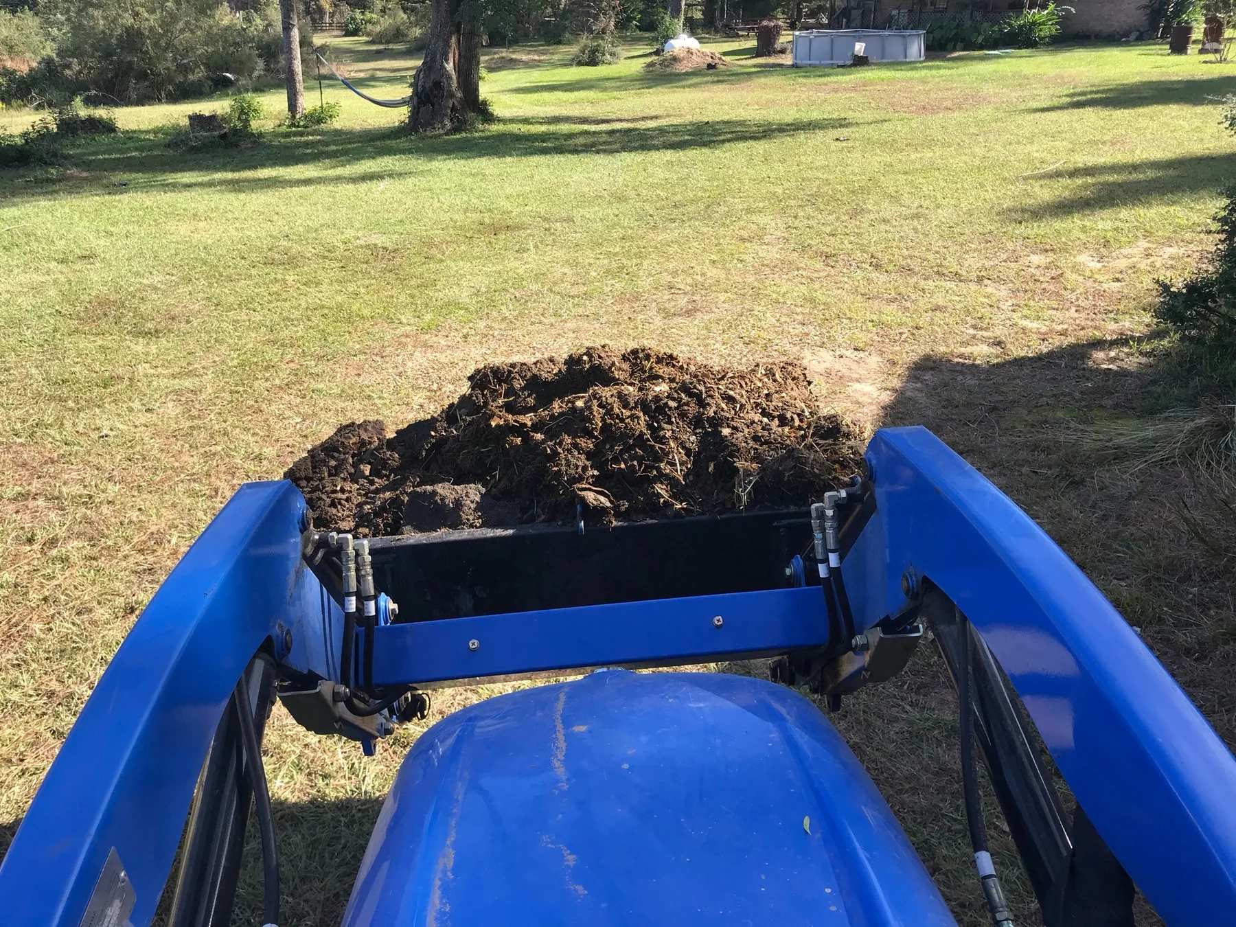 Front loader moving soil and material